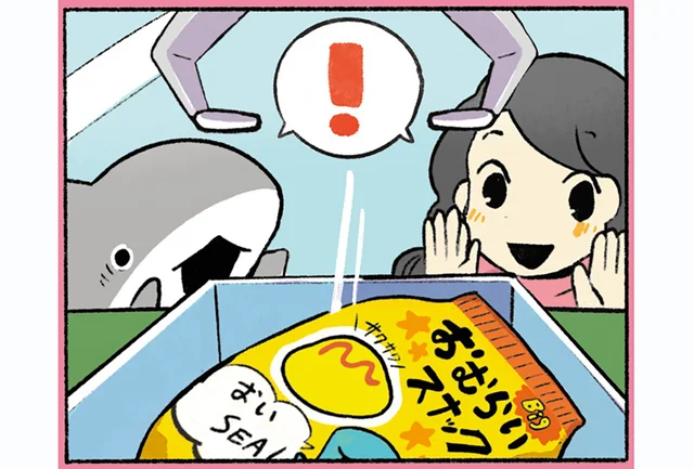 ゲームセンターに来た子ザメ。お菓子が欲しくてクレーンゲームに挑戦します！／おでかけ子ザメ3（7）