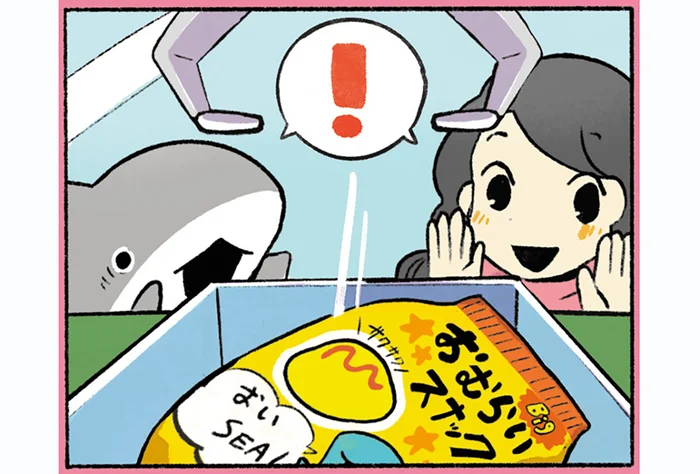 ゲームセンターに来た子ザメ。お菓子が欲しくてクレーンゲームに挑戦します！／おでかけ子ザメ3（7）