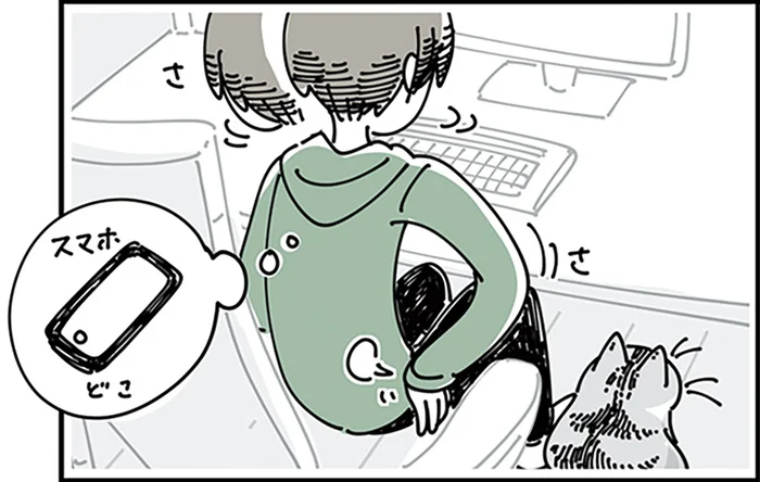 少し遠い場所にあるスマホ。取るのを諦めた矢先に猫が珍しいポーズをして