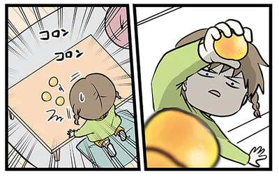 みかんを積み上げようとして