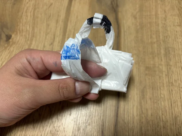 今度は長い持ち手（青）の輪に...（▶次へ）