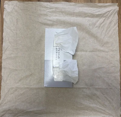 布の両サイドを結んで布で包む方法も（▶次へ）