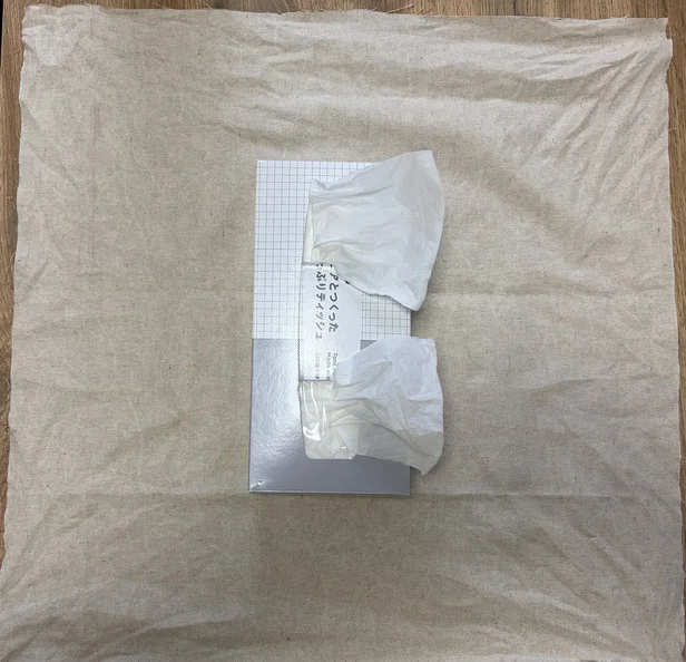 布の両サイドを結んで布で包む方法も（▶次へ）