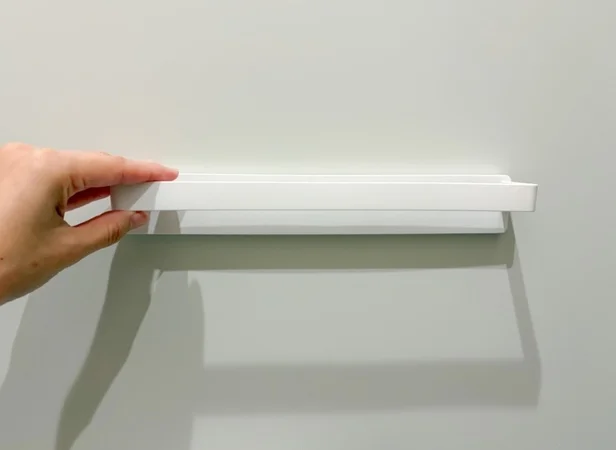 タオルハンガーをドアにくっつける（▶次へ）