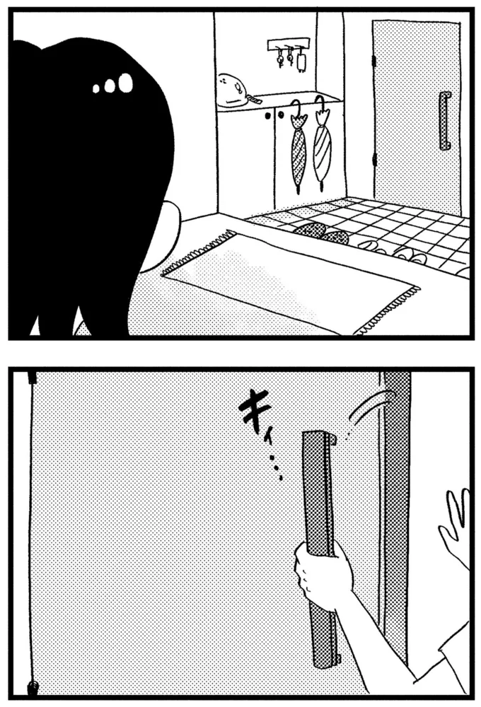 玄関のドアを開けて
