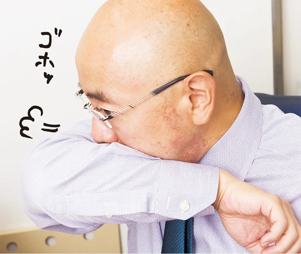 <せきをするときは腕で覆う>